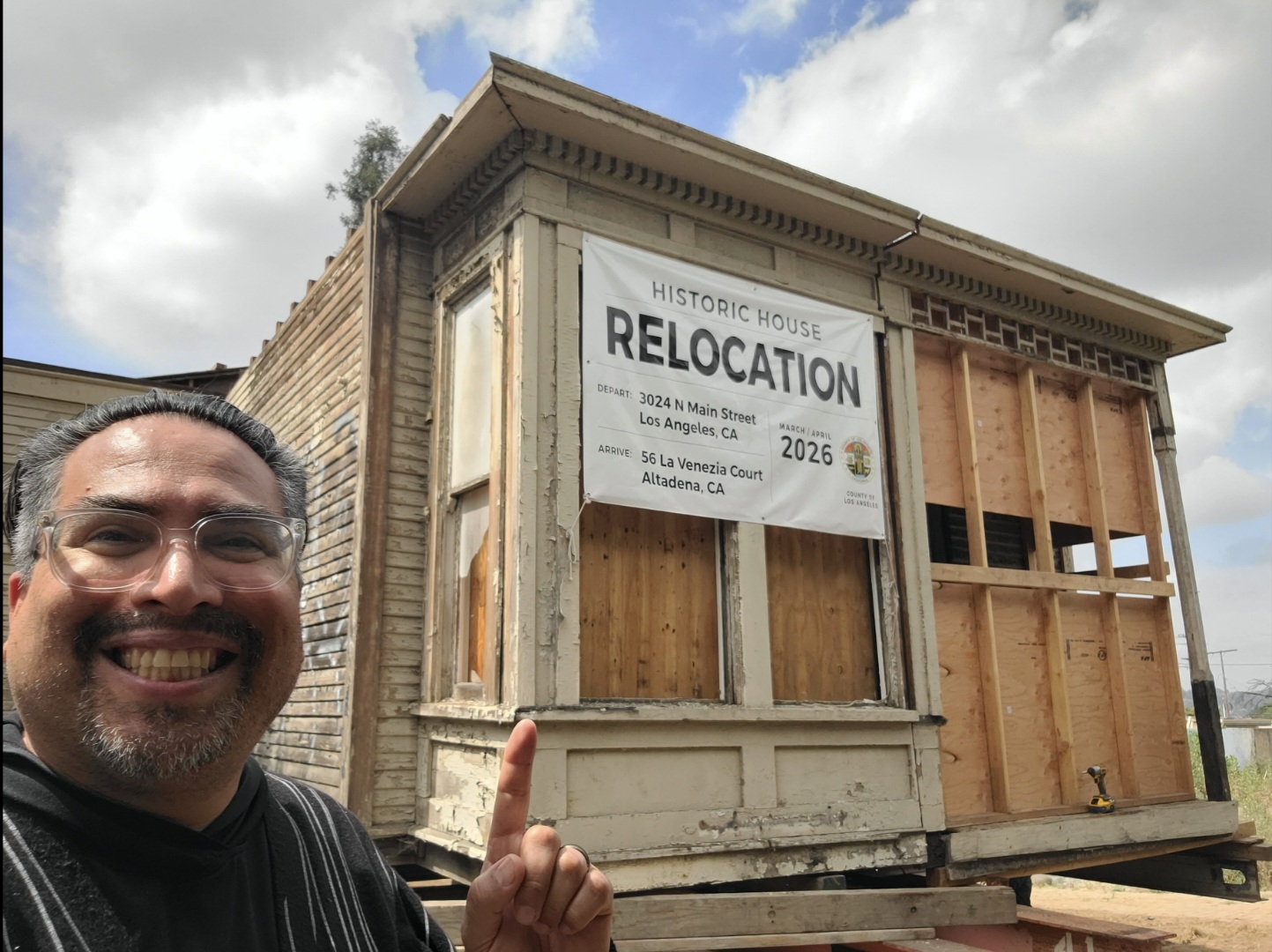 Alan Pinel, Founder of HouseRelocation.LA, points to a section of the relocated house to be placed on La Venezia Court