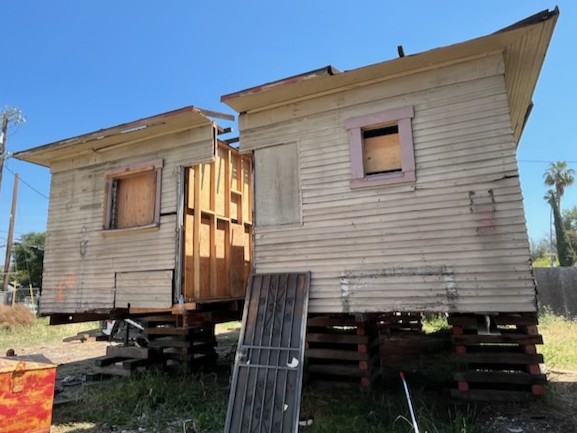 A House in Lincoln Heights was cut in half and the roof was removed before transportation to Calaveras Street in Altadena